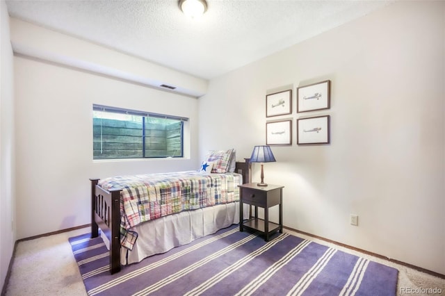 510 Silhouette Way, Monument, CO 80132 - bedroom with a textured ceiling and carpet floors