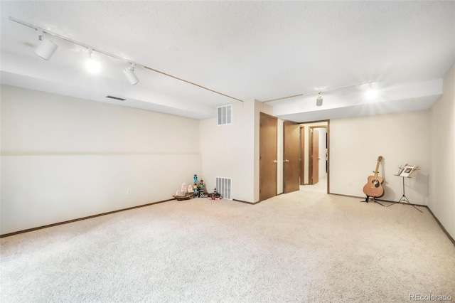 510 Silhouette Way, Monument, CO 80132 - finished basement featuring carpet floors and rail lighting