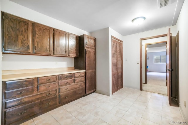 510 Silhouette Way, Monument, CO 80132 - kitchen with light countertops, light tile patterned floors, and light carpet