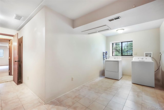 510 Silhouette Way, Monument, CO 80132 - laundry room featuring washing machine and dryer and light tile patterned floors