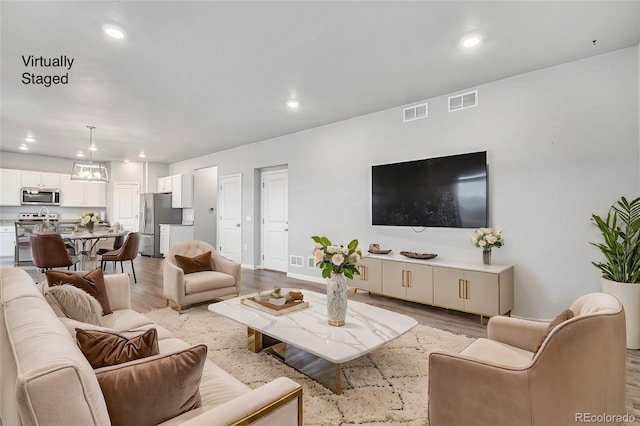 living room featuring light wood-type flooring