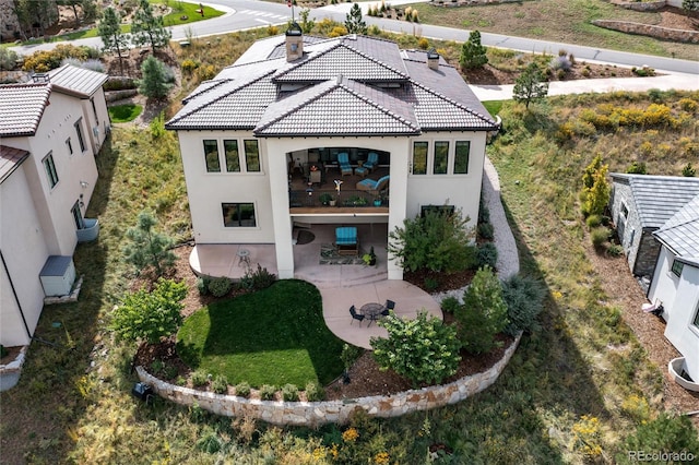 rear view of property featuring a patio