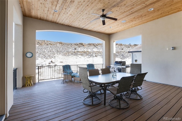 snow covered deck featuring a grill and ceiling fan