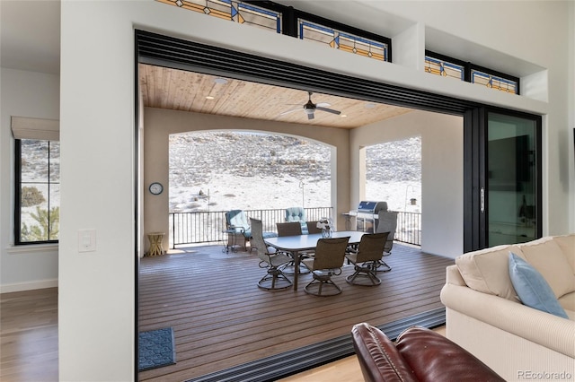 dining room featuring wood-type flooring and ceiling fan