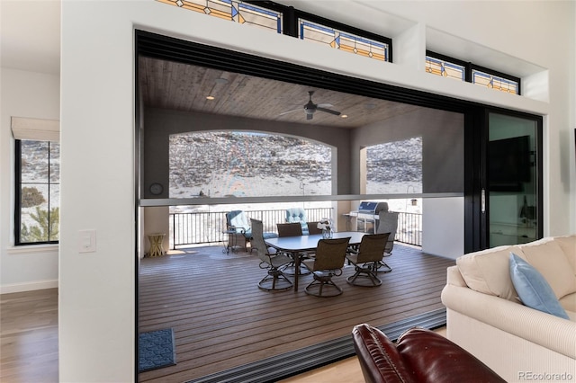 interior space with ceiling fan, a healthy amount of sunlight, wood-type flooring, and wood ceiling