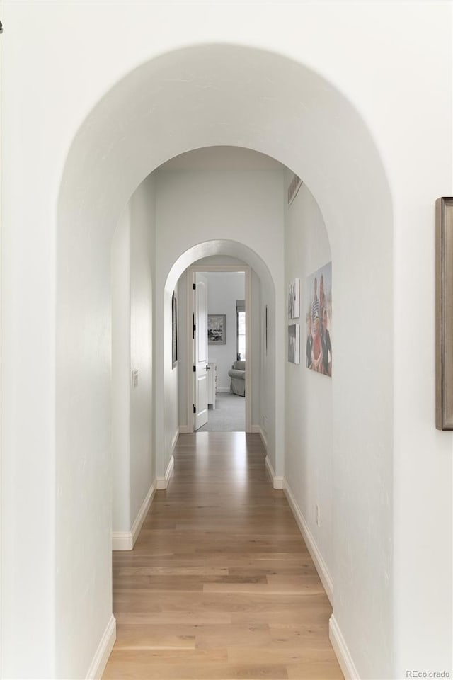 hallway featuring light wood-type flooring