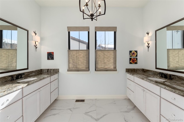 bathroom featuring vanity and an inviting chandelier