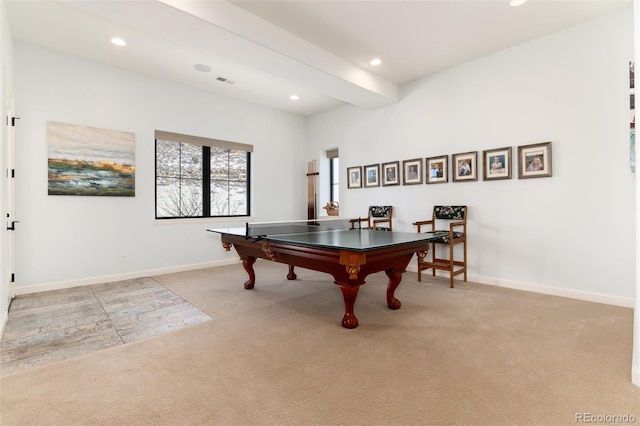 recreation room with light colored carpet