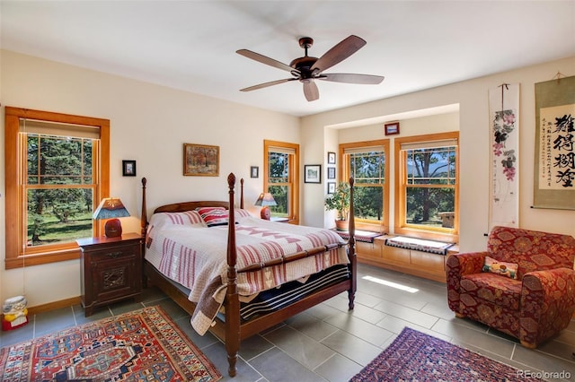 tiled bedroom with ceiling fan