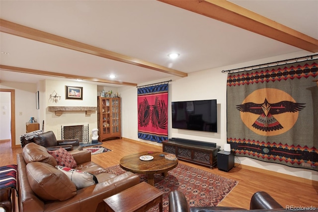 living room with wood-type flooring and beam ceiling