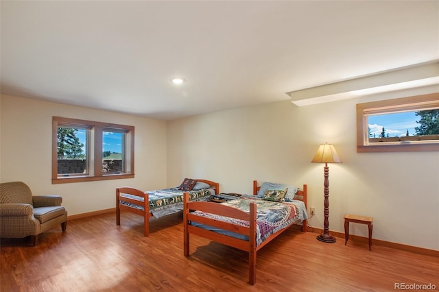 bedroom with wood-type flooring