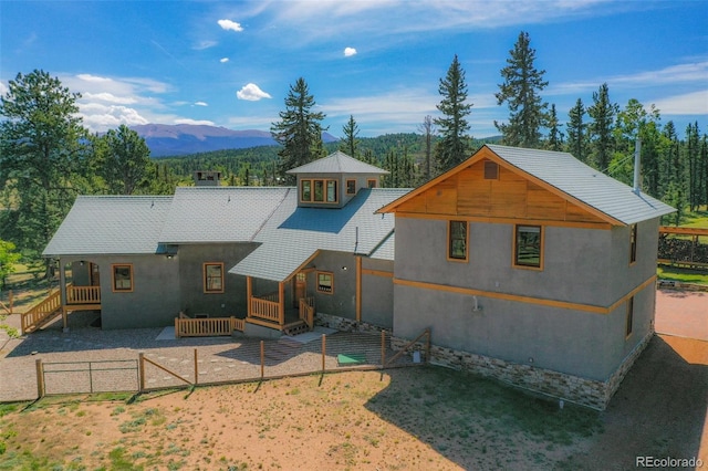 rear view of house with a mountain view