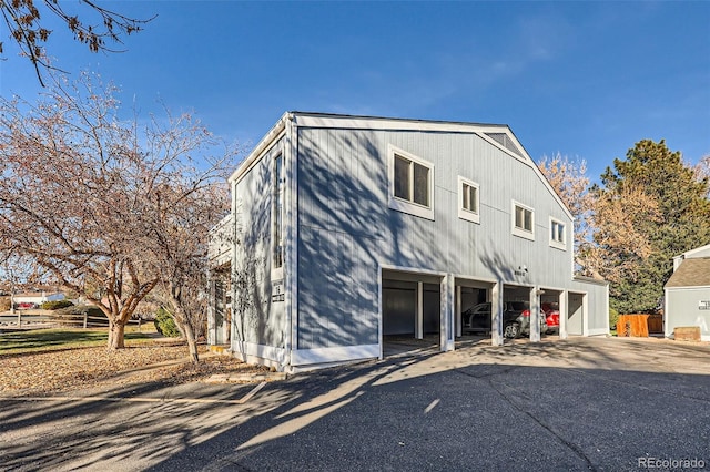 rear view of property with a garage