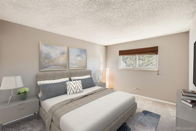 bedroom with carpet and a textured ceiling