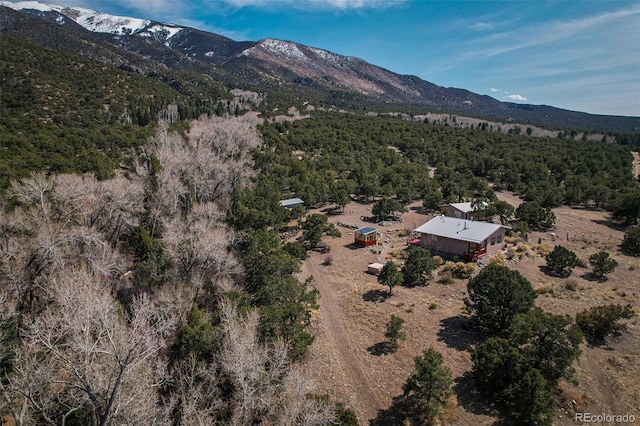 125 Deer Run, Mosca, CO 81146 - aerial view of property and surrounding area featuring mountains and a heavily wooded area