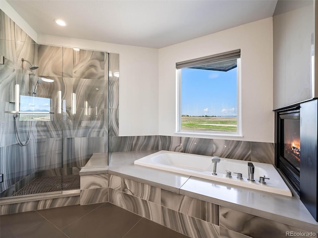 bathroom with plus walk in shower and tile patterned flooring