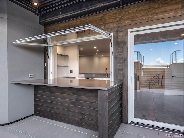 interior space featuring tile patterned floors and sink