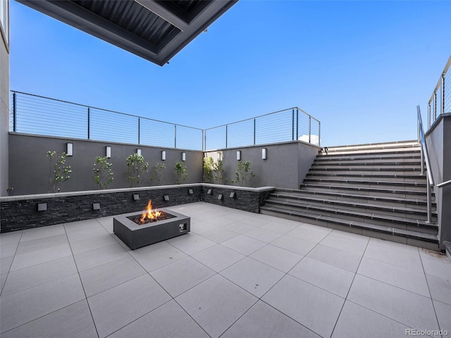 view of patio featuring a fire pit