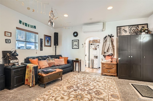 carpeted living room featuring a wall mounted air conditioner and vaulted ceiling