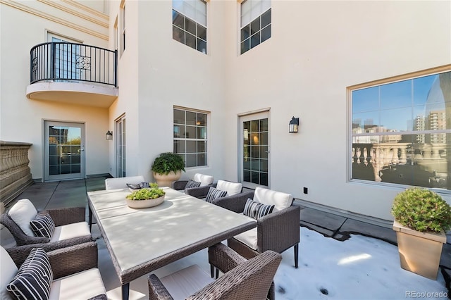 view of patio / terrace featuring a balcony and an outdoor living space