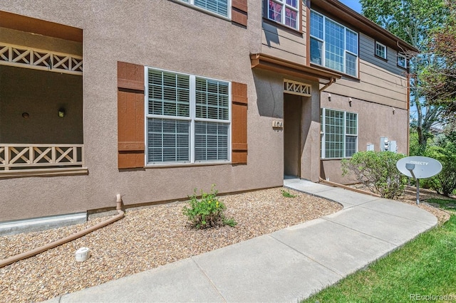 11972 W Long Cir Unit 104, Littleton, CO 80127 - property entrance with stucco siding