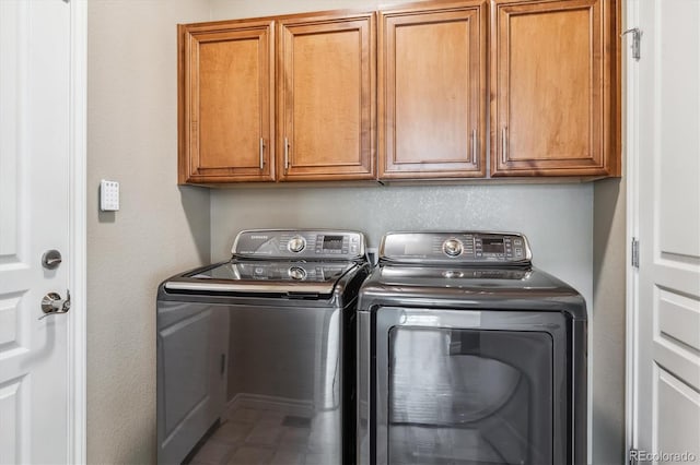 11972 W Long Cir Unit 104, Littleton, CO 80127 - washroom with washing machine and clothes dryer and cabinet space