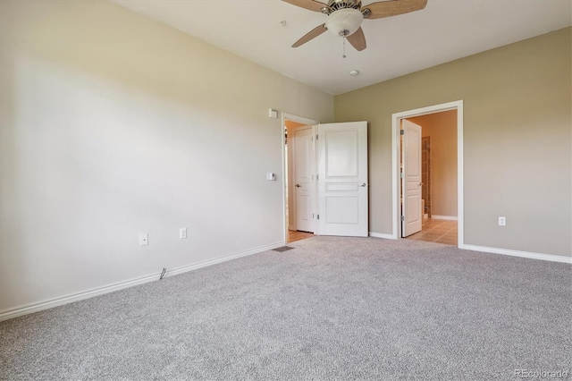 11972 W Long Cir Unit 104, Littleton, CO 80127 - unfurnished bedroom with light colored carpet and ceiling fan