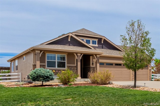 10653 E 163rd Ct, Brighton, CO 80602 - craftsman inspired home featuring concrete driveway, stone siding, an attached garage, and roof with shingles