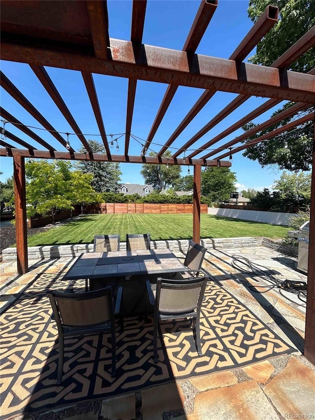 view of patio / terrace featuring a pergola and outdoor dining space