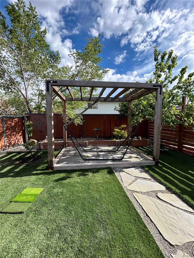 view of yard featuring a fenced backyard and a deck