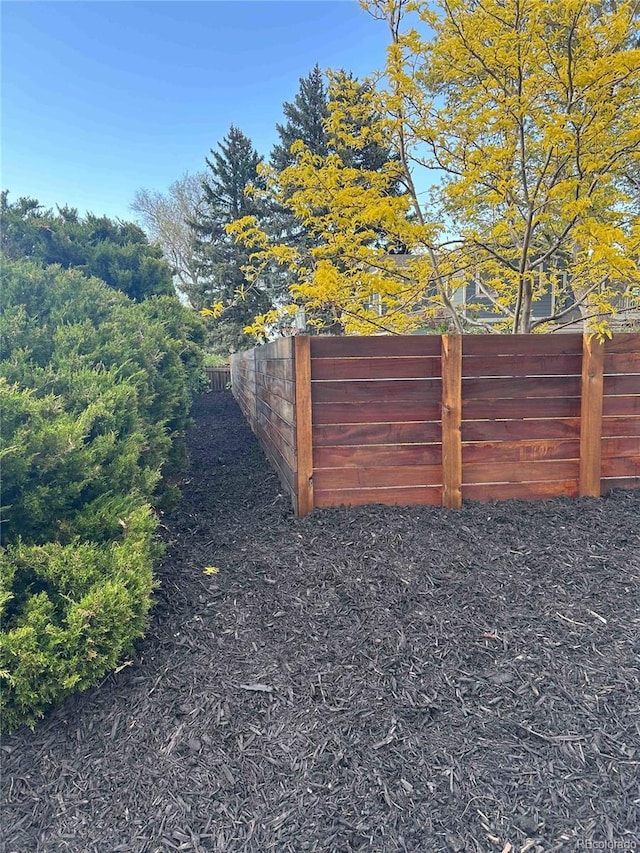 view of gate with fence