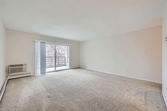 spare room featuring a baseboard radiator, an AC wall unit, and carpet