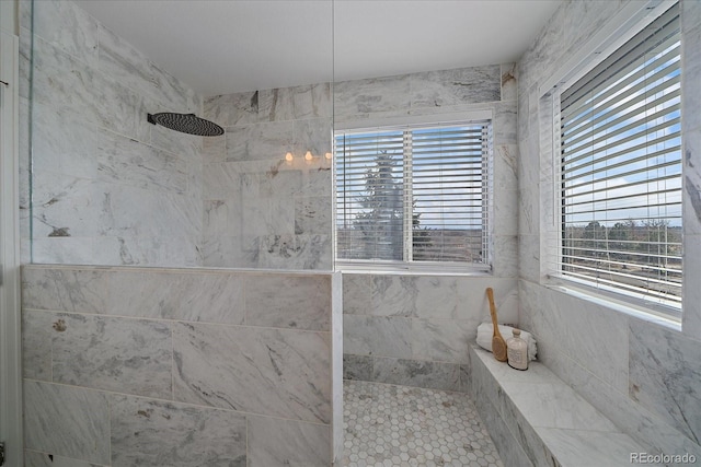 full bathroom featuring a tile shower