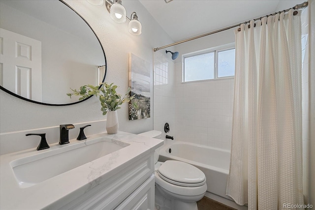 bathroom featuring shower / bathtub combination with curtain, toilet, and vanity