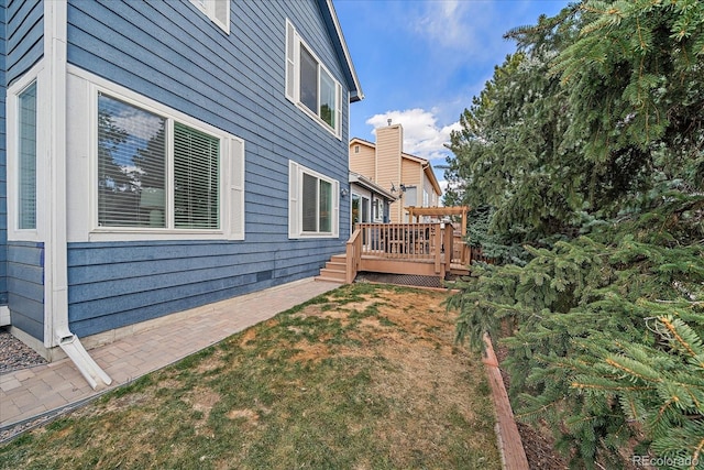 view of yard with a wooden deck