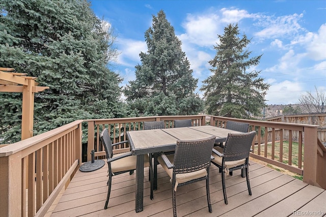 wooden deck with outdoor dining area