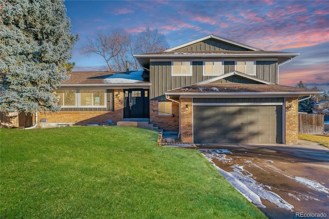 7649 E Amherst Ave, Denver, CO 80231 - tri-level home with brick siding, concrete driveway, and board and batten siding
