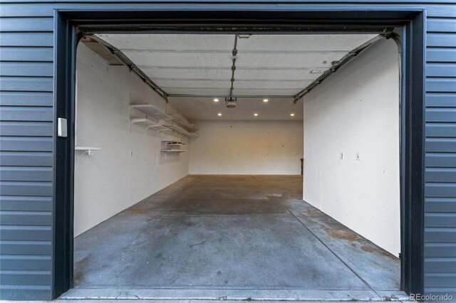 8120 W 54th Pl, Arvada, CO 80002 - garage featuring a garage door opener and recessed lighting