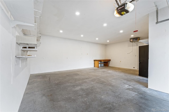 8120 W 54th Pl, Arvada, CO 80002 - garage featuring a garage door opener and recessed lighting