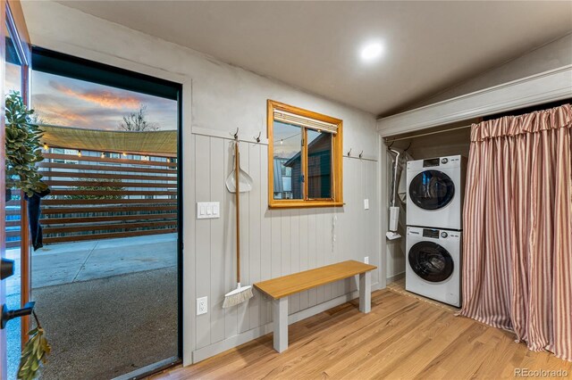 8120 W 54th Pl, Arvada, CO 80002 - laundry area featuring estacked washer and dryer and light wood finished floors
