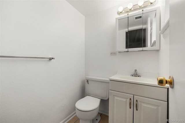 9240 E Girard Ave Unit 1, Denver, CO 80231 - bathroom featuring toilet, vanity, and baseboards