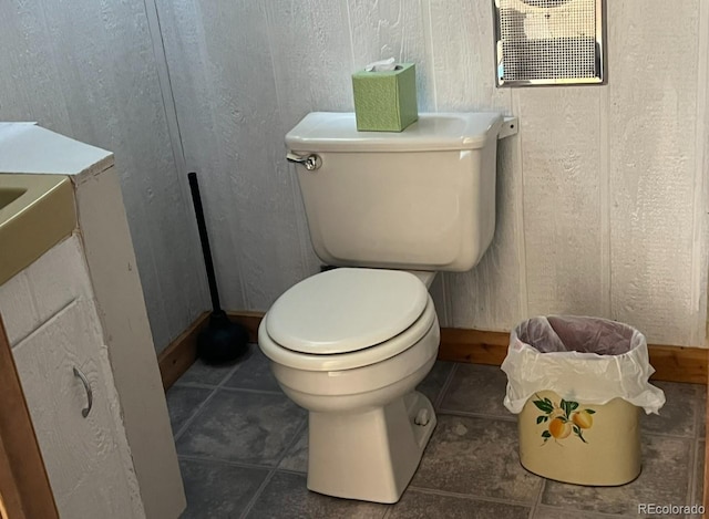 bathroom featuring tile floors and toilet