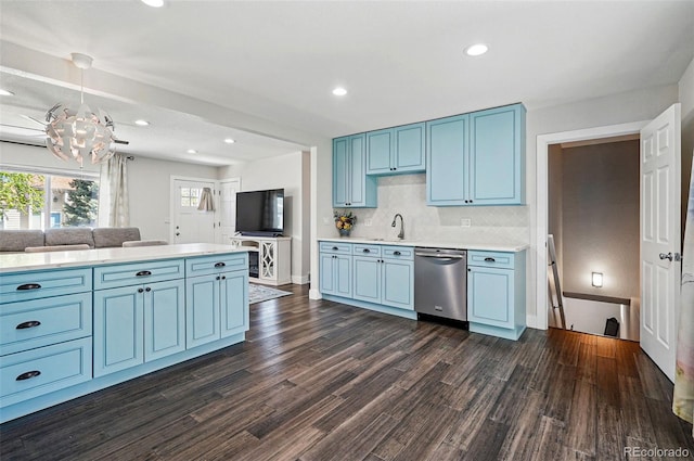 6655 S Elm Cir, Centennial, CO 80121 - kitchen featuring dishwasher, blue cabinetry, a sink, light countertops, and dark wood-type flooring