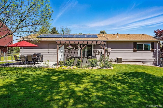 6655 S Elm Cir, Centennial, CO 80121 - back of property with solar panels, a patio, and central AC