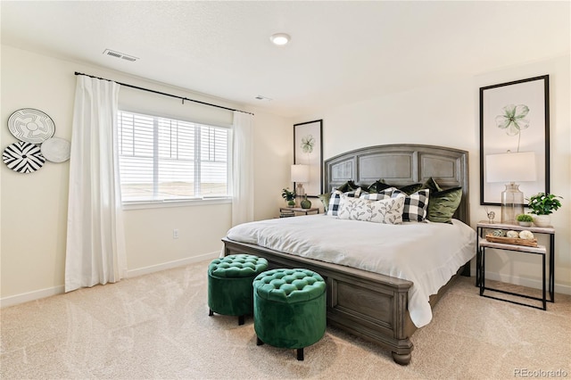 bedroom featuring light colored carpet