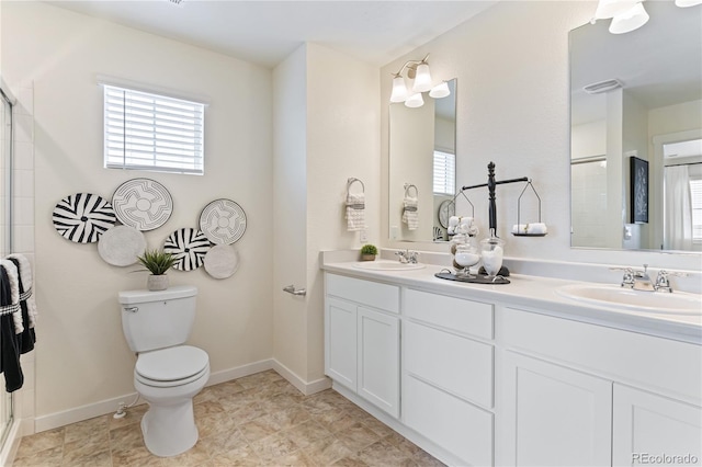 bathroom with toilet and vanity