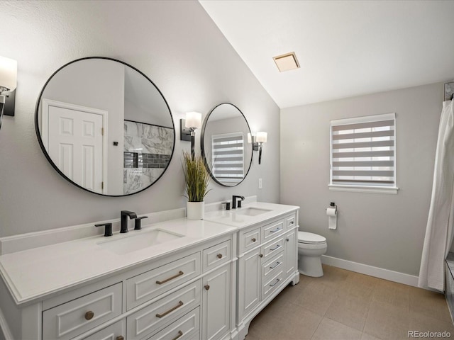 bathroom with tile patterned floors, vanity, vaulted ceiling, a shower, and toilet