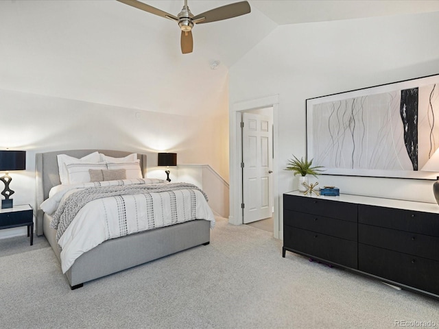 carpeted bedroom with ceiling fan and lofted ceiling