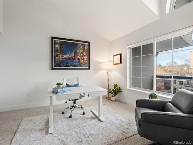 home office featuring baseboards, lofted ceiling, and carpet floors