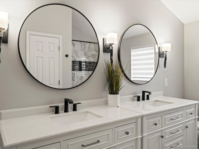 full bath featuring a sink and double vanity